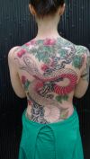 snake tats on girl's back. 